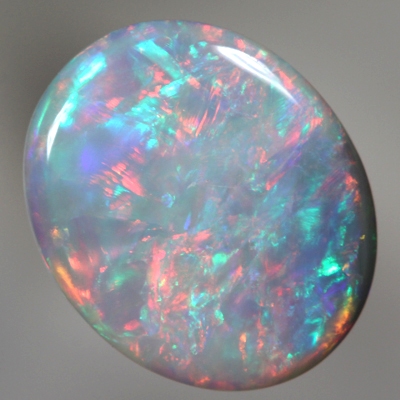 SOLID SEMI BLACK OPAL Rolling flashes of red over green and blue. SEE VIDEO